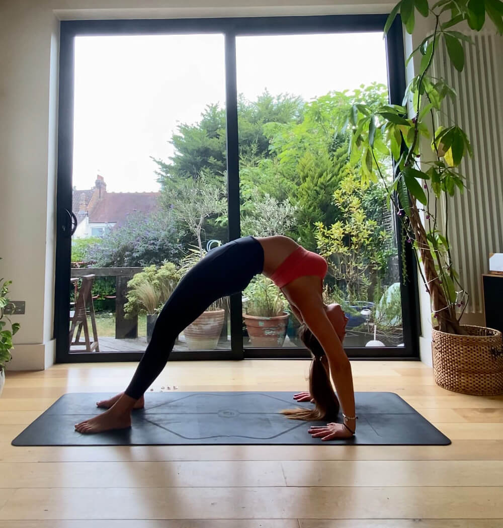 Yoga teacher Aimee Warren in wheel pose